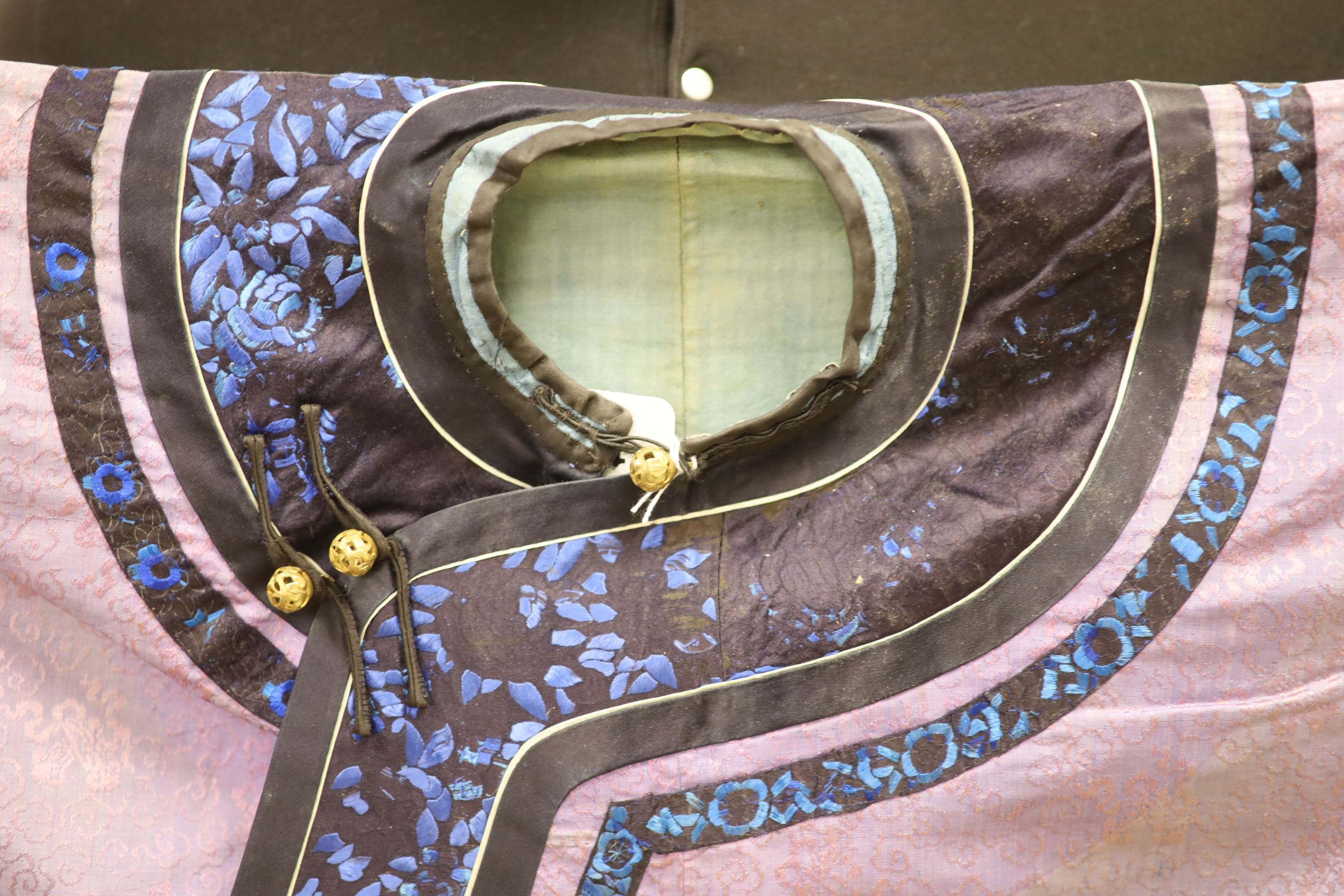 A Chinese lilac silk embroidered robe, early 20th century with multi-coloured embroidery and wide embroidered sleeve bands,